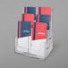 A clear plastic Deflecto brochure holder with 6 compartments holding brochures.