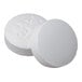 A pair of round, white acetaminophen tablets.