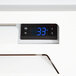 A Beverage-Air MarketMax refrigerated glass door merchandiser with a digital thermostat.