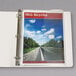 A C-Line clear poly binder pocket on a binder with a picture of a road.