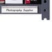 A black metal shelf with a clear C-Line shelf labeling strip attached to the front.