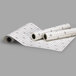 A roll of C-Line Cleer Adheer laminating film with a grid pattern.