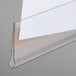 A clear plastic C-Line label holder on a white sheet of paper.