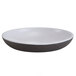 An Elite Global Solutions Kona white melamine plate with a chocolate rim.