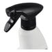 A white plastic spray bottle with a black trigger nozzle, used for dispensing stainless steel cleaner and polish.