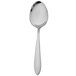 A close-up of a Walco stainless steel dessert spoon with a silver handle.