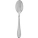 A close-up of a Walco stainless steel dessert spoon with a handle.