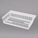 a white plastic tray with holes