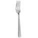 A silver Walco stainless steel dinner fork with a white handle.