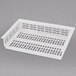A white plastic container with holes.
