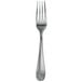 A close-up of a Walco stainless steel dinner fork with a fieldstone finish.