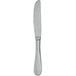 A Walco Fieldstone Finish stainless steel dinner knife with a silver handle.