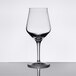 A clear Stolzle stemmed beer glass on a reflective surface.
