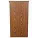 A wooden lectern with a medium oak finish and a wood panel on the front.