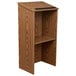 A wooden Oklahoma Sound lectern with a shelf on top.