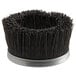 A round black brush with a silver metal rim.