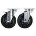 A pair of Vulcan casters with black rubber wheels.