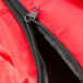 A red Rubbermaid insulated delivery bag with a zipper.
