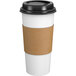 a white cup with a brown band around it