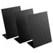 Three black rectangular American Metalcraft tabletop chalkboard signs on metal stands.