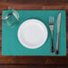 a plate and fork and knife on a place mat