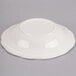 An ivory china bowl with a scalloped edge.