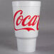 A white Dart foam cup with red Coca-Cola text.