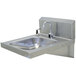 An Advance Tabco stainless steel hands-free hand sink with faucet and soap dispenser.