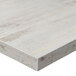 A BFM Seating Relic Antique Wash rectangular table top with a white wood surface.