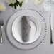 a table setting with silverware and a napkin on a plate