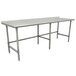 An Advance Tabco stainless steel work table with an open base and long top.