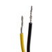 A close up of a Lavex push switch with two black and yellow wires.