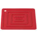 A red rectangular Lodge silicone pot holder.