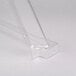 A clear plastic sneeze guard on a white surface.