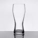 A Libbey customizable pilsner glass on a table with a white background.