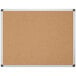 A MasterVision cork board with metal frame.