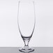 A close-up of a Stolzle Imperial stemmed beer glass with a clear rim and small base.