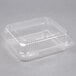 A Durable Packaging clear hinged lid plastic container.