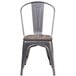 A Flash Furniture metal restaurant chair with a wooden seat and back.