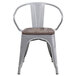 A Flash Furniture silver metal chair with a wood seat.
