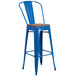 A blue bar stool with a wooden seat.