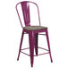A purple metal restaurant bar stool with a wooden seat.