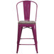A purple metal restaurant bar stool with a wooden seat.