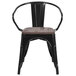 A black metal Flash Furniture restaurant chair with a wooden seat.