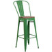 A green Flash Furniture metal bar stool with a wooden seat.