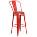 a red metal bar stool