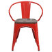 A red metal Flash Furniture restaurant chair with a wood seat and vertical slat back.