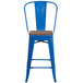 A blue metal restaurant bar stool with a wooden seat.