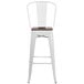 A white Flash Furniture bar stool with a wood seat and vertical slat back.
