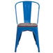 A Flash Furniture blue metal restaurant chair with a wooden seat.